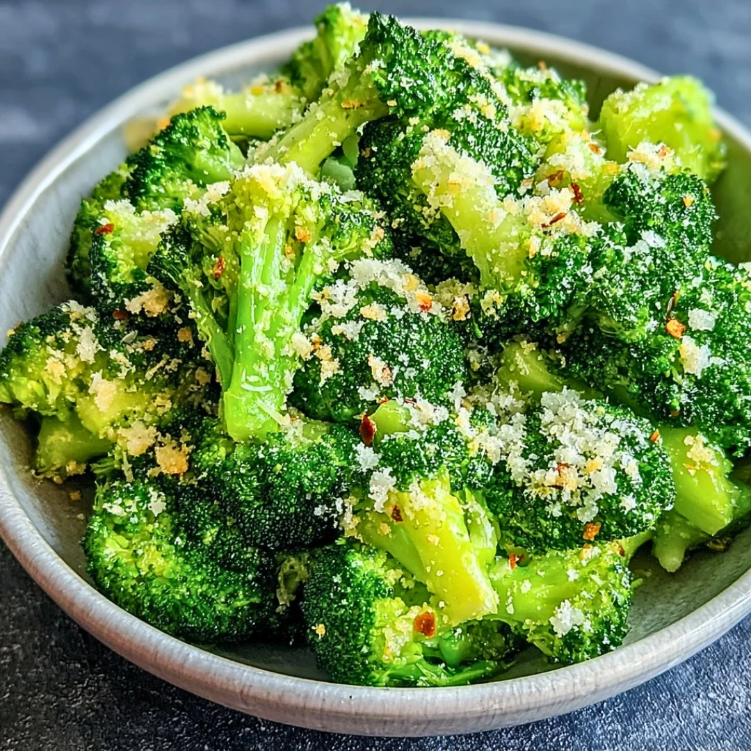 Delicious Longhorn Garlic Parmesan Broccoli dish garnished with cheese and garlic.