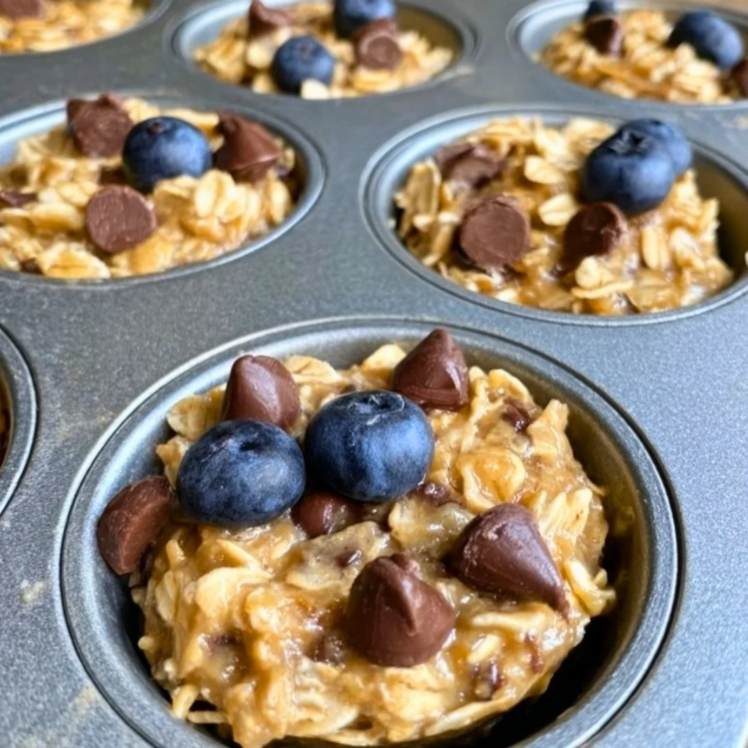 Delicious 3 ingredient banana oat muffins on a wooden table