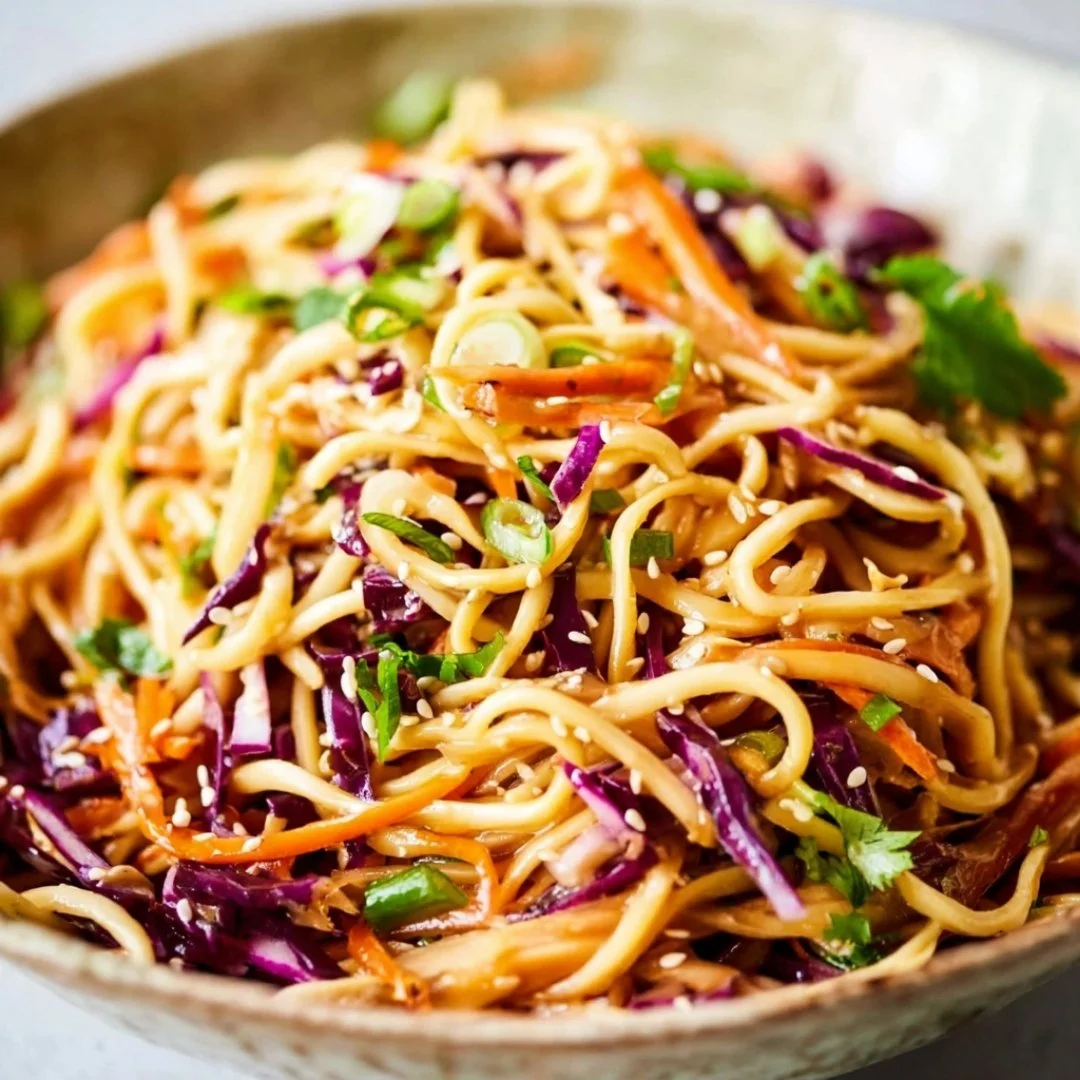 Colorful Asian Noodle Salad with fresh vegetables and sesame dressing