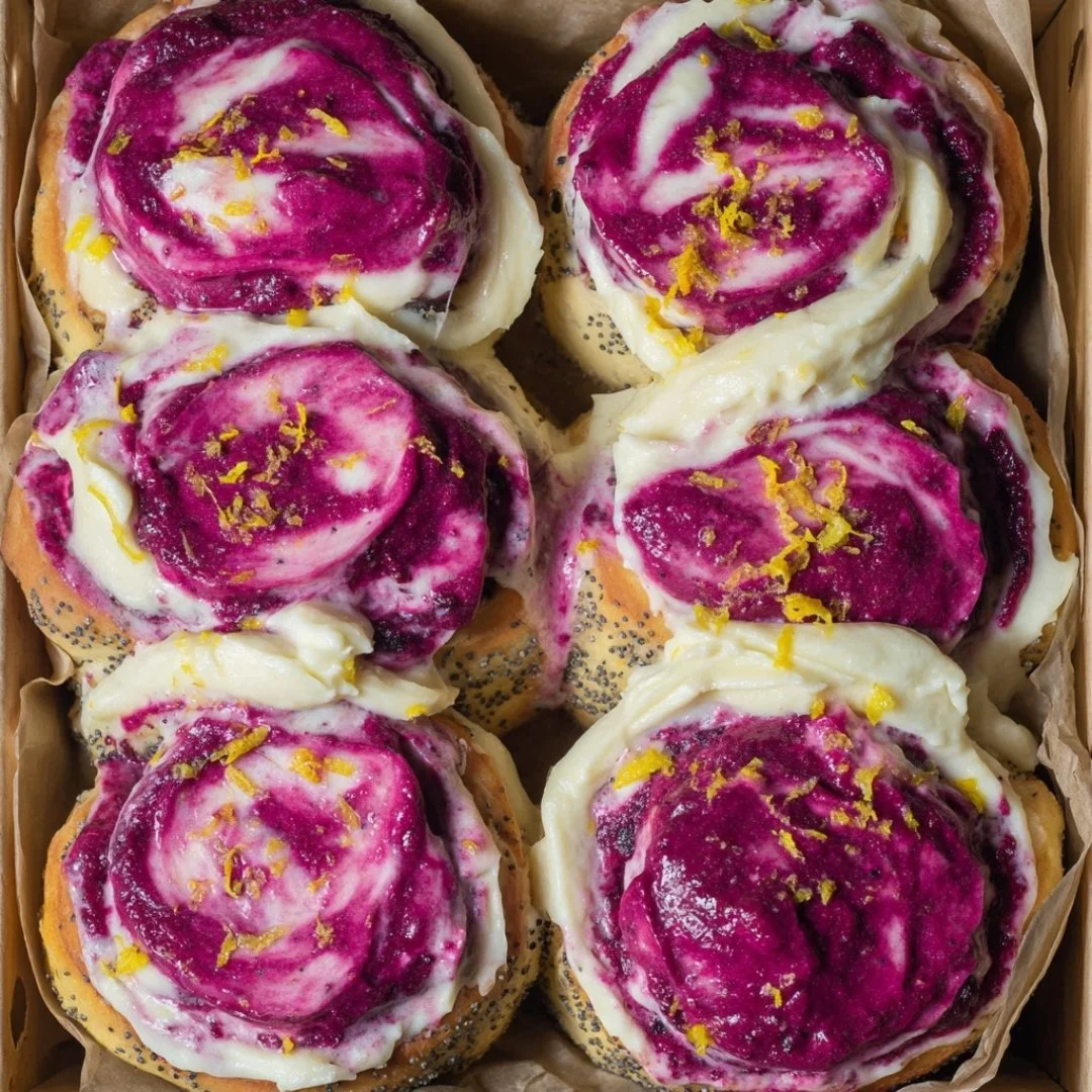 Freshly baked Blueberry Lemon Poppy Seed Rolls with vibrant blueberries and poppy seeds